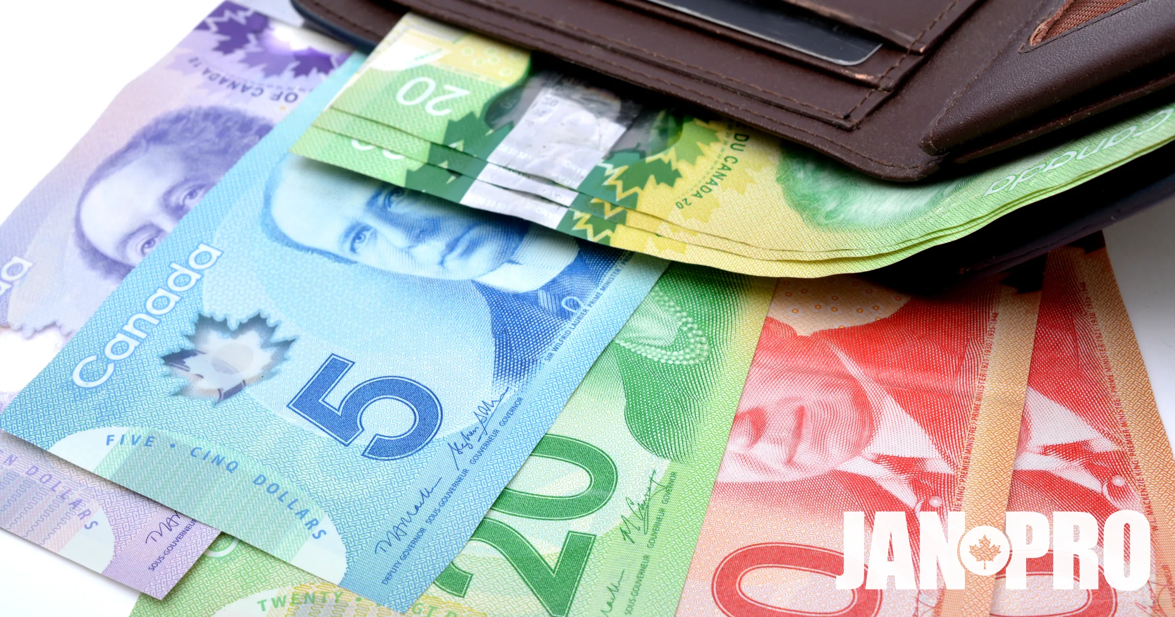 Canadian money coming out of a wallet