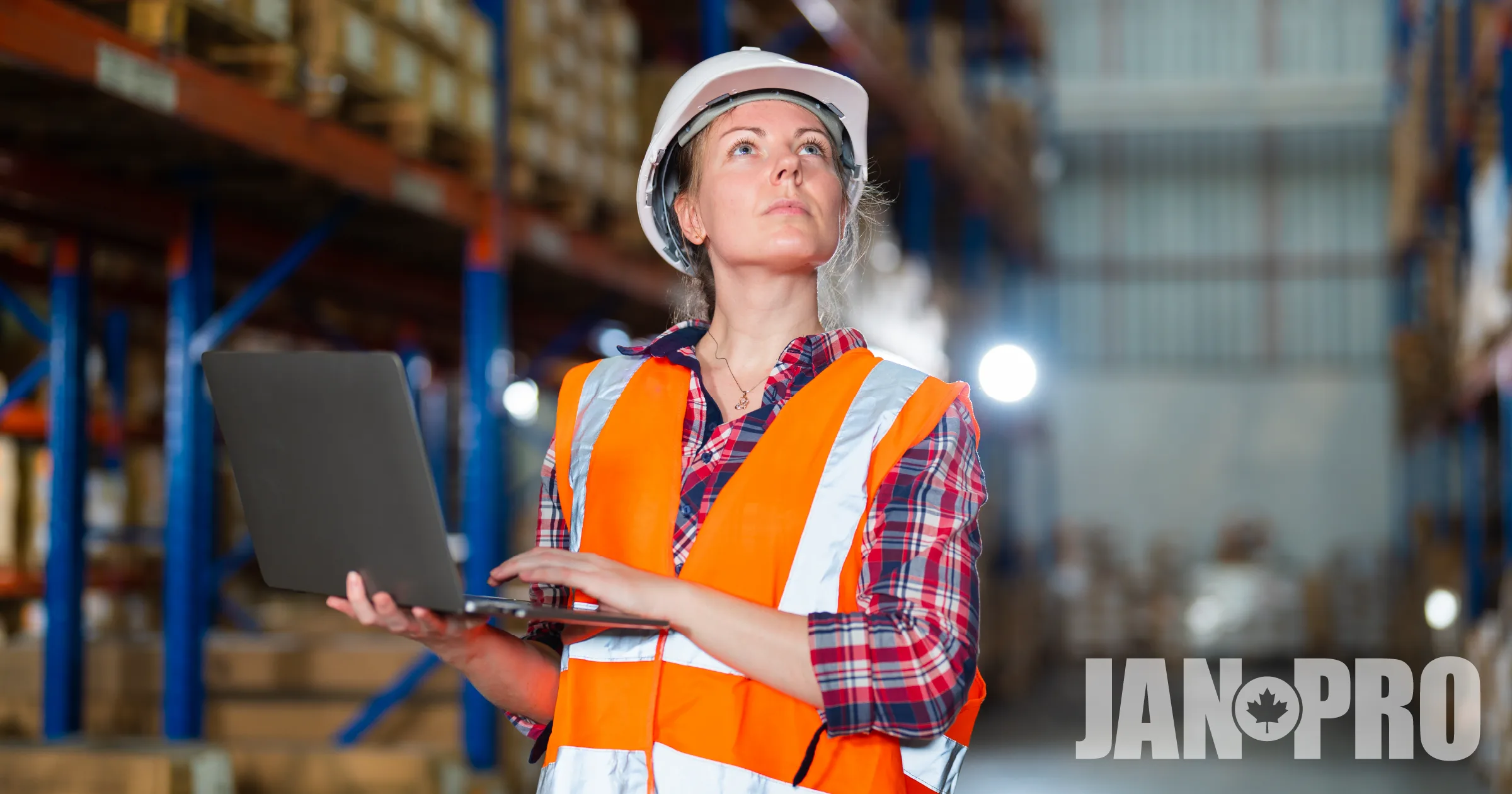Facility manager reviews building operations in a warehouse, highlighting commercial cleaning as essential facility infrastructure.